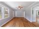 Bright living room with hardwood floors, ceiling fan, and large windows letting in natural light at 1019 Magbee Se Dr, Smyrna, GA 30080