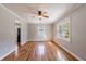 Inviting living room featuring hardwood floors, neutral walls, and a modern ceiling fan at 1019 Magbee Se Dr, Smyrna, GA 30080