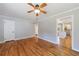 Comfortable living room showcasing hardwood floors, a ceiling fan, and neutral paint throughout at 1019 Magbee Se Dr, Smyrna, GA 30080