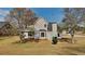 A view of the back of the home and grass backyard at 4688 Snap Creek Ln, Decatur, GA 30035