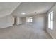 Bright bonus room offers flexible living with large windows, and plush carpet flooring at 4688 Snap Creek Ln, Decatur, GA 30035