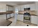 Well-equipped kitchen featuring modern appliances, stylish cabinetry, and ample counter space at 4688 Snap Creek Ln, Decatur, GA 30035