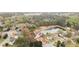 Aerial view of property with lake, surrounded by mature trees, and established neighborhood at 1340 Summer Lake Ter, Loganville, GA 30052