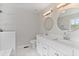 Bright bathroom featuring double vanity, marble tile backsplash, modern fixtures, and a tiled shower at 1340 Summer Lake Ter, Loganville, GA 30052