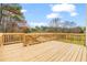 Spacious wooden deck perfect for outdoor entertaining with views of the surrounding greenery at 1340 Summer Lake Ter, Loganville, GA 30052