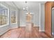 Bright dining area featuring wood floors, large windows, and modern lighting fixture at 1340 Summer Lake Ter, Loganville, GA 30052