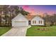 Charming home with white siding, brown roof, well-manicured lawn, and attached garage at 1340 Summer Lake Ter, Loganville, GA 30052