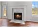 Close up of the marble fireplace featuring a hearth, mantel, and tile surround in the living room at 1340 Summer Lake Ter, Loganville, GA 30052