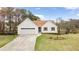 Charming one story home featuring a two-car garage, well-manicured lawn, and inviting curb appeal at 1340 Summer Lake Ter, Loganville, GA 30052