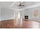 Open concept living room featuring a marble fireplace, hardwood floors, and access to an outdoor deck at 1340 Summer Lake Ter, Loganville, GA 30052