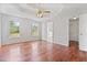 Spacious main bedroom features a tray ceiling, hardwood floors, and ensuite bathroom and walk-in closet at 1340 Summer Lake Ter, Loganville, GA 30052