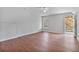 Large room with hardwood floors, a ceiling fan, and a window offering ample natural light at 1340 Summer Lake Ter, Loganville, GA 30052