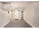 This basement features neutral walls and carpet, closets, and ample space at 1946 Glenwood Downs Dr, Decatur, GA 30035