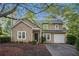 Charming two-story home featuring a front-entry garage and well-maintained landscaping at 1946 Glenwood Downs Dr, Decatur, GA 30035