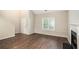 An inviting living room featuring high ceilings, hardwood floors and a cozy fireplace at 1946 Glenwood Downs Dr, Decatur, GA 30035