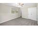 Comfortable bedroom with soft carpet, ample natural light, and a closet for convenient storage at 3380 Saddleton Way, Douglasville, GA 30134