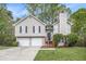 Charming two-story home with neutral siding, black shutters, and a two-car garage, set on a well-manicured lawn at 3380 Saddleton Way, Douglasville, GA 30134
