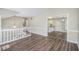 Spacious living room with hardwood floors, neutral walls, and seamless flow into the open-concept kitchen at 3380 Saddleton Way, Douglasville, GA 30134