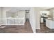 Open-concept living area with hardwood floors seamlessly connects to the kitchen, ideal for entertaining and gatherings at 3380 Saddleton Way, Douglasville, GA 30134