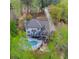 Aerial view of house with a pool in a spacious backyard with deck at 3510 Donegal Way, Snellville, GA 30039