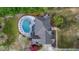 Stunning aerial view of a home with a pool and a large backyard perfect for outdoor relaxation and entertainment at 3510 Donegal Way, Snellville, GA 30039