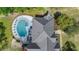 Aerial view of home showcasing a backyard pool with lounge area at 3510 Donegal Way, Snellville, GA 30039