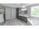A bathroom features a soaking tub, storage, a shower, and plenty of counter space at 3510 Donegal Way, Snellville, GA 30039