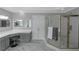 Beautiful primary bathroom showcasing a glass shower, and a spacious vanity with a makeup area at 3510 Donegal Way, Snellville, GA 30039