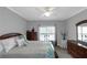 This primary bedroom features a ceiling fan, carpet, and window for natural light at 3510 Donegal Way, Snellville, GA 30039