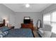 A comfortable bedroom with great natural light boasts a ceiling fan and traditional furnishings at 3510 Donegal Way, Snellville, GA 30039
