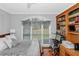 Bright bedroom with large window and built-in shelving and desk at 3510 Donegal Way, Snellville, GA 30039