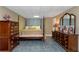 Traditional bedroom featuring dark wood furniture and tile flooring at 3510 Donegal Way, Snellville, GA 30039