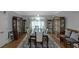 Formal dining room with a long table, chandelier, and built-in display cabinets at 3510 Donegal Way, Snellville, GA 30039