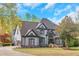 Charming two-story home with landscaped yard, two car garage and beautiful windows at 3510 Donegal Way, Snellville, GA 30039