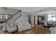 Bright living room with a staircase, comfortable seating, and an adjacent formal dining area at 3510 Donegal Way, Snellville, GA 30039