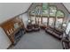Large living room featuring a fireplace, expansive windows, and comfortable seating at 3510 Donegal Way, Snellville, GA 30039