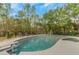 Backyard pool with deck and fence in a home's lush backyard at 3510 Donegal Way, Snellville, GA 30039
