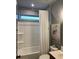Clean bathroom features a combination bathtub and shower, complemented by a window and modern fixtures, providing a functional layout at 63 Aspen Way, Dallas, GA 30157
