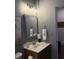 Well-lit bathroom with a stylish mirror and modern fixtures at 63 Aspen Way, Dallas, GA 30157
