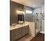 Stylish bathroom with dual vanity, sleek mirrors, and a frameless glass shower at 63 Aspen Way, Dallas, GA 30157