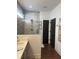 Modern bathroom featuring a glass shower, gray cabinets and luxury finishes at 63 Aspen Way, Dallas, GA 30157