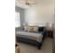 Relaxing bedroom features a comfortable bed with a plush headboard and stylish bedding, complemented by bedside lamps and tables at 63 Aspen Way, Dallas, GA 30157