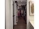 A beautiful walk-in closet provides ample storage for clothes and shoes at 63 Aspen Way, Dallas, GA 30157
