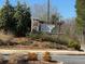 Stone sign featuring native plants welcomes you to the Poplar Place community at 63 Aspen Way, Dallas, GA 30157