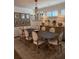 Dining room with large table, chairs, and buffet with decorative items at 63 Aspen Way, Dallas, GA 30157
