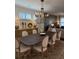 Dining room with a large table, chairs, modern chandelier, and buffet at 63 Aspen Way, Dallas, GA 30157