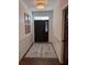 Well-lit entryway features a decorative rug and elegant wall paneling at 63 Aspen Way, Dallas, GA 30157