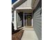 Welcoming front entrance featuring a stylish door with decorative wreath and adjacent window at 63 Aspen Way, Dallas, GA 30157