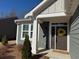 Inviting front entrance featuring a stylish door with decorative wreath and adjacent window at 63 Aspen Way, Dallas, GA 30157