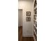 Charming hallway adorned with artistic decor, featuring built-in shelving and natural light, offers a warm welcome at 63 Aspen Way, Dallas, GA 30157